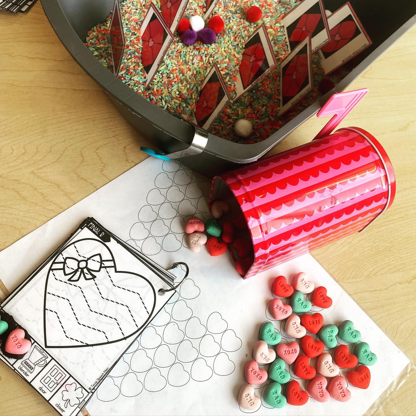 Valentine&rsquo;s themed speech activity with candy hearts, a toy mailbox, and practice cards.